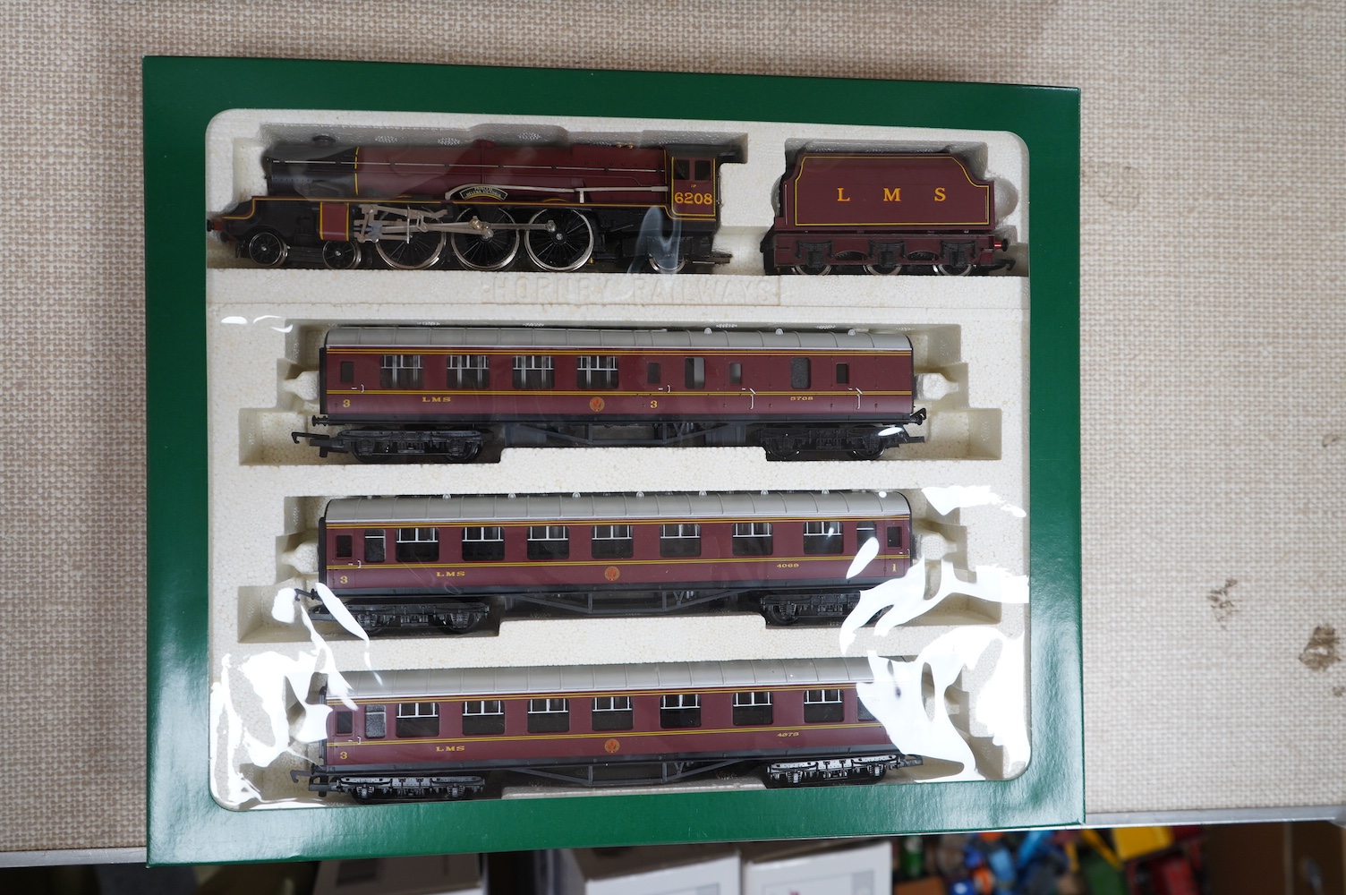 Three boxed Hornby Railways 00 gauge train packs; ‘The Flying Scotsman’ comprising of a Class A3 locomotive with two tenders (R098), together with The Flying Scotsman three coach set (R089), plus an LMS ‘The Royal Scot’